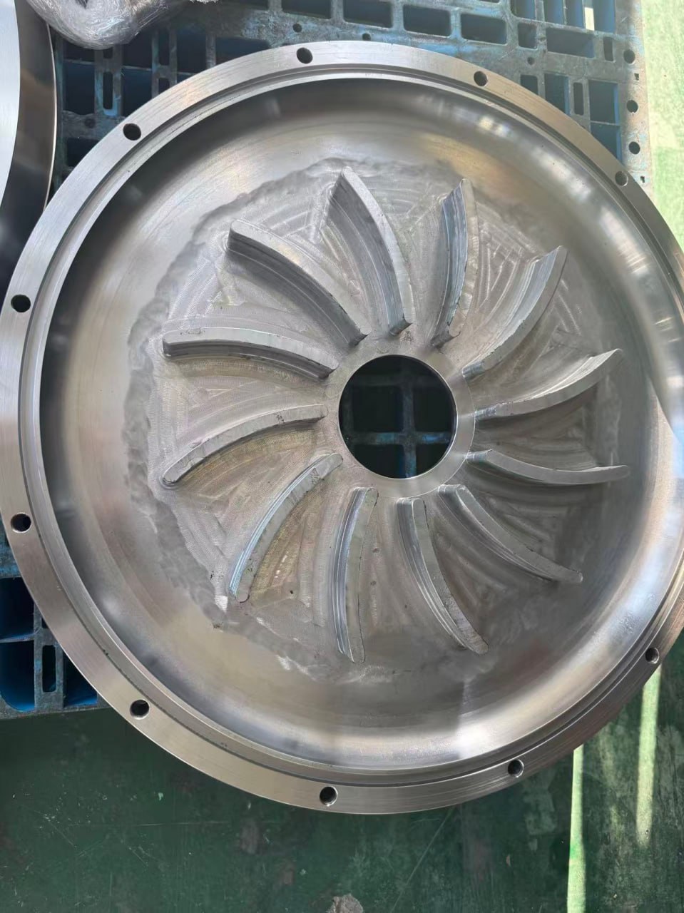 Large custom machined pump component with internal vanes