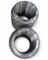 Close-up of finished nitrided pump hard sealing ring with machined thread and sealing surfaces